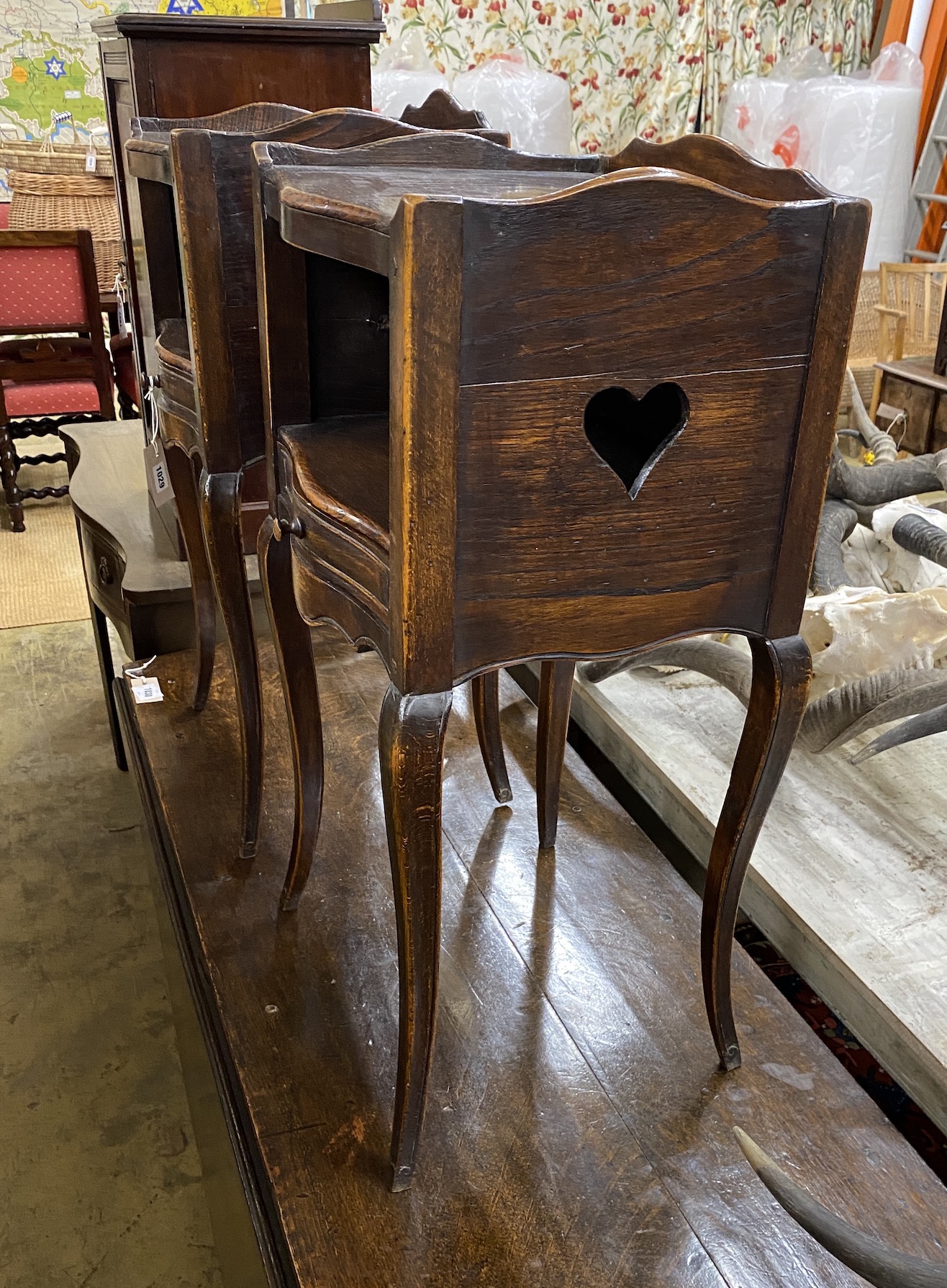 A pair of French elm and beech serpentine bedside cabinets, width 39cm, depth 34cm, height 78cm